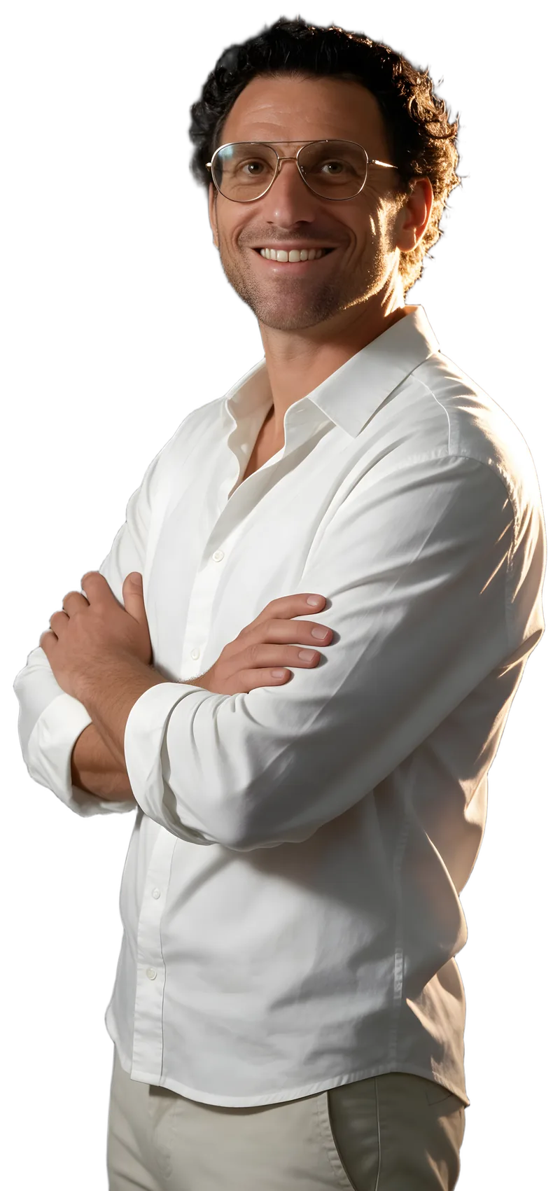Eddie Shabot, arms crossed, smiling, in a white shirt